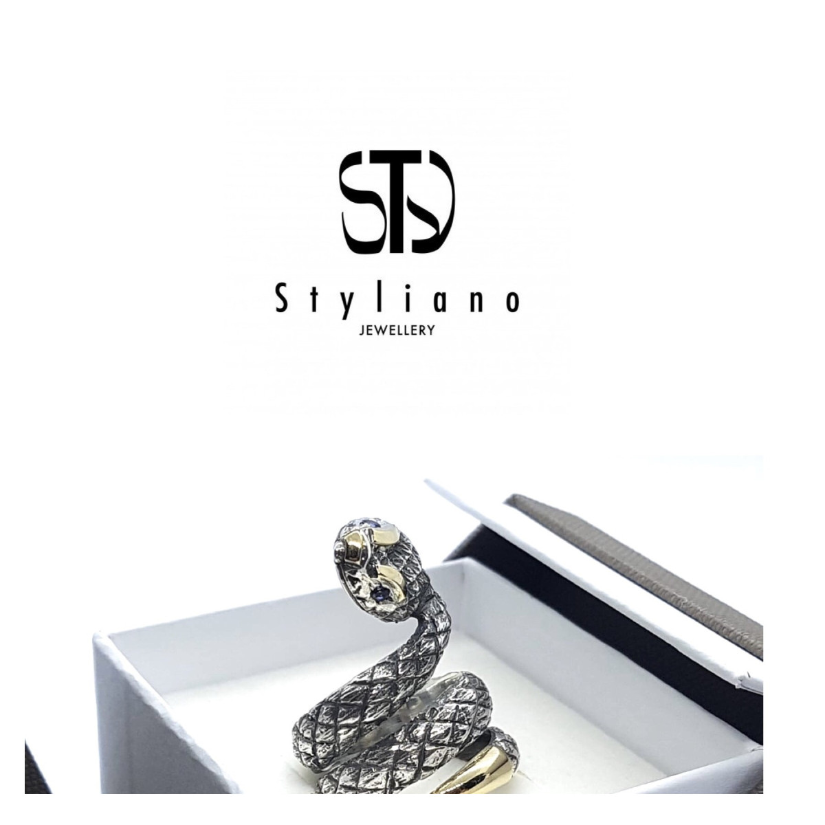 Anillo de plata y oro con forma de serpiente y iolitas